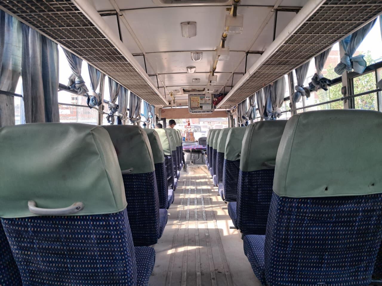 Bus front parked near buildings