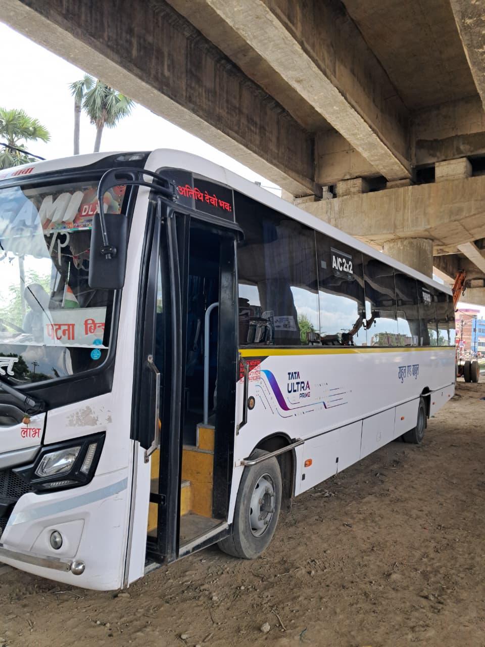 Bus front angled under flyover, Tata Ultra Prime