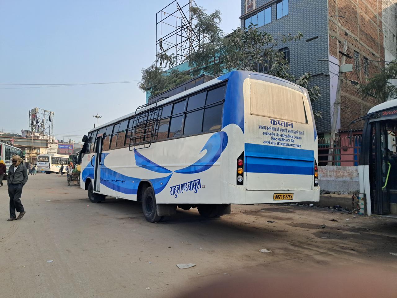 Bus rear angled view, blue wave livery