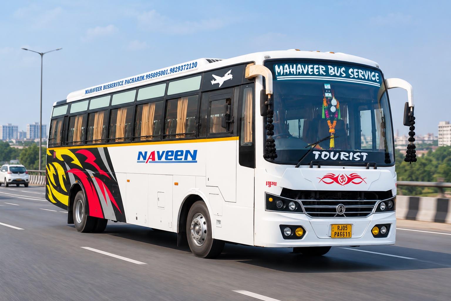 White tourist coach with red and yellow graphics on the road